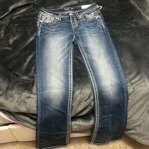 these are midrise boot cut jeans from Miss me size 26x34 unworn!!